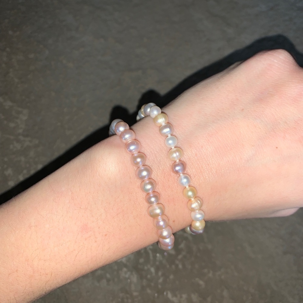 TWO LIGHT PINK BRACELETS